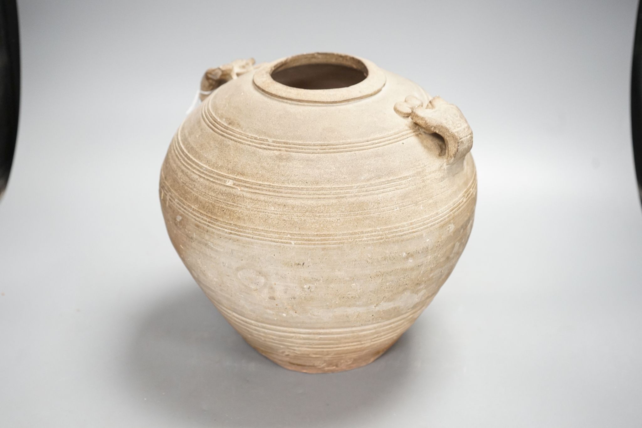 A Chinese Warring States pottery jar, 24cm